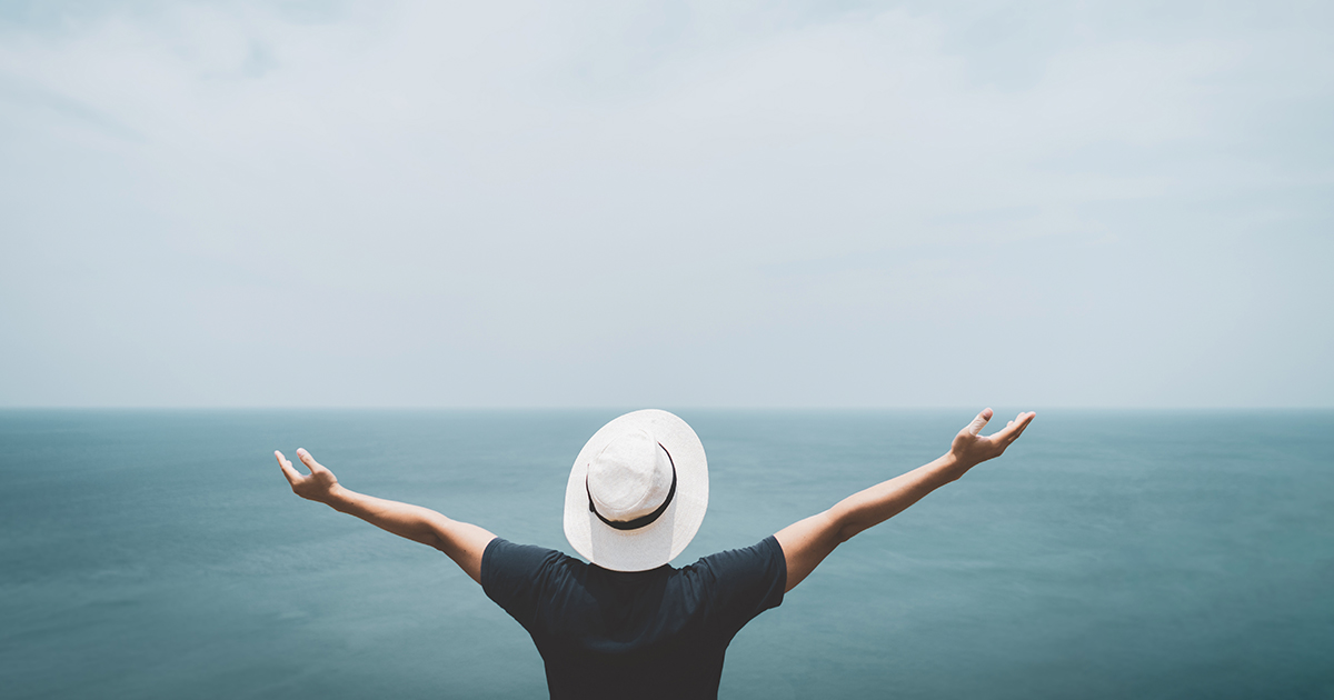 Man with outstretched arms welcoming the latest Sitecore XP release